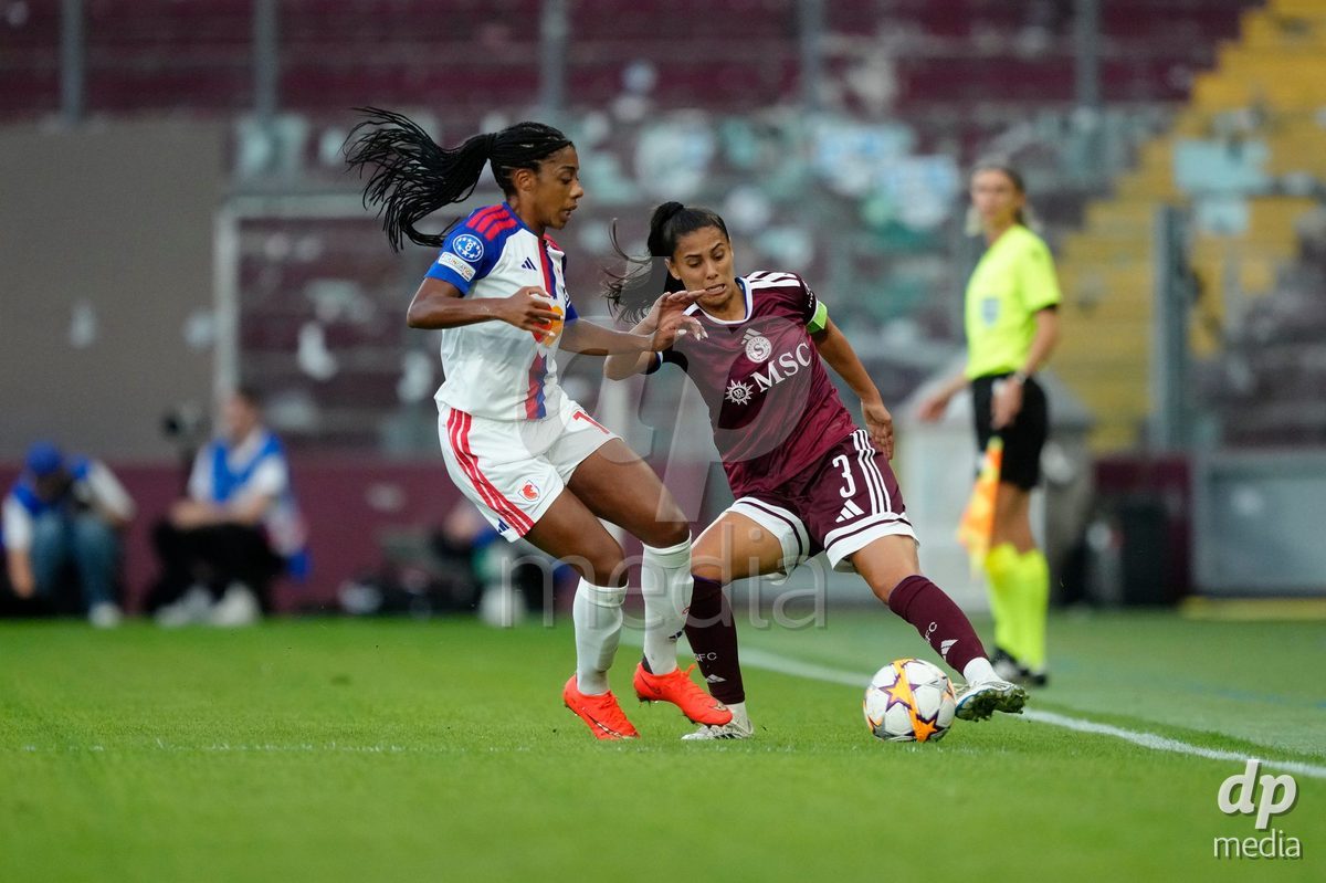 GENEVA, SWITZERLAND - SEPTEMBER 23: Daina Bourma of Servette FC Chenois Feminin against Ashley Lawrence of Olympique Lyon during the UEFA Women's Champions League match between Servette FC Chenois Feminin and OL Lyonnes at Stade de Geneve on September 23, 2026 in Geneva, Switzerland.