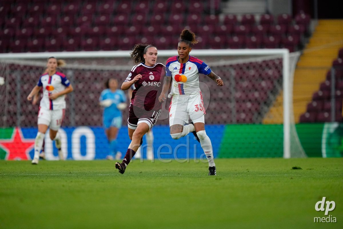 GENEVA, SWITZERLAND - SEPTEMBER 23: Magdalena Sobal of Servette FC Chenois Feminin against Tarciane dos Santos de Lima of Olympique Lyon during the UEFA Women's Champions League match between Servette FC Chenois Feminin and OL Lyonnes at Stade de Geneve on September 23, 2026 in Geneva, Switzerland.