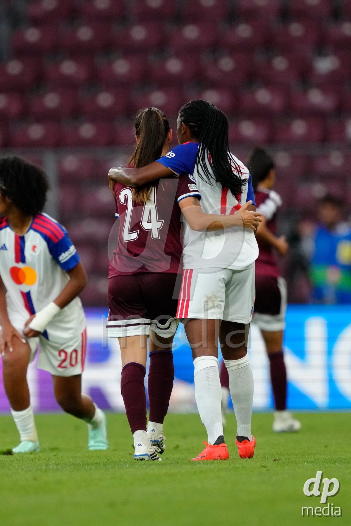 GENEVA, SWITZERLAND - SEPTEMBER 23: Joana Marchao of Servette FC Chenois Feminin together with Ashley Lawrence of Olympique Lyon after a foul during the UEFA Women's Champions League match between Servette FC Chenois Feminin and OL Lyonnes at Stade de Geneve on September 23, 2026 in Geneva, Switzerland.