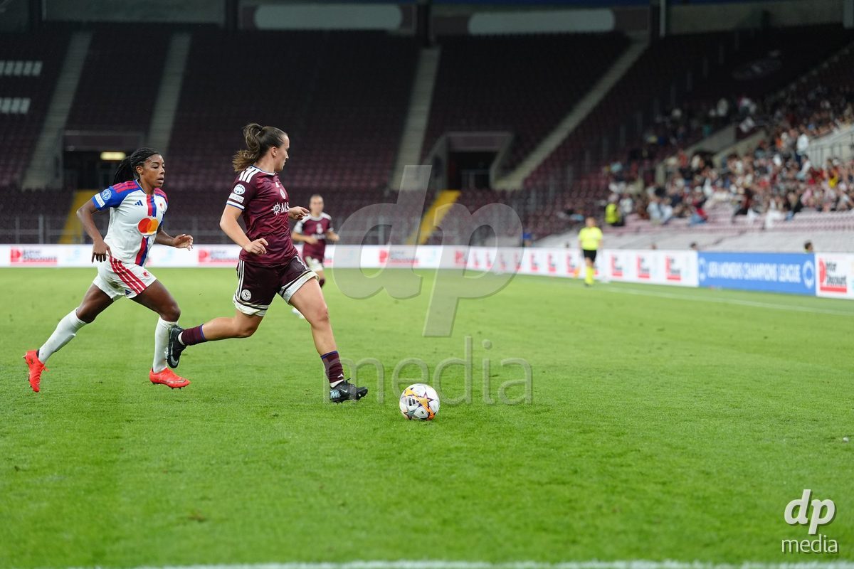 GENEVA, SWITZERLAND - SEPTEMBER 23: Ashley Lawrence of Olympique Lyon against Magdalena Sobal of Servette FC Chenois Feminin during the UEFA Women's Champions League match between Servette FC Chenois Feminin and OL Lyonnes at Stade de Geneve on September 23, 2026 in Geneva, Switzerland.