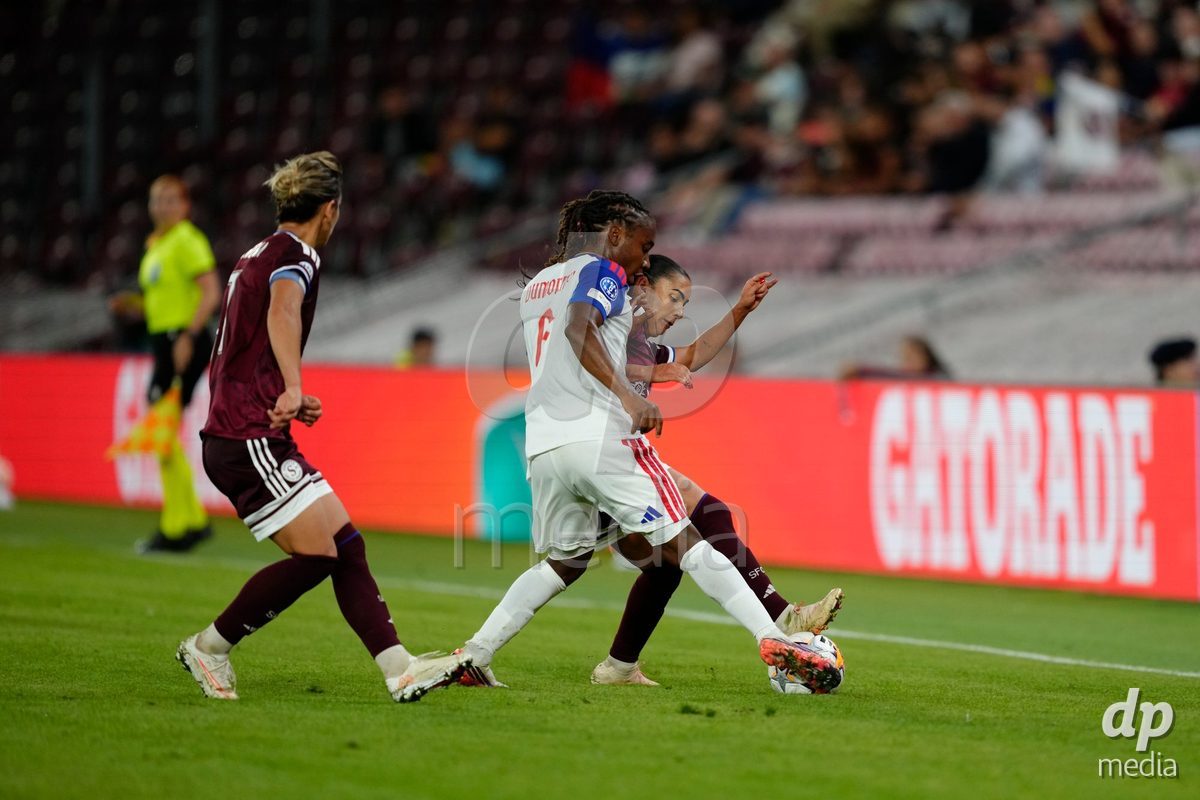 GENEVA, SWITZERLAND - SEPTEMBER 23: Meriame Terchoun of Servette FC Chenois Feminin against Melchie Dumornay of Olympique Lyon during the UEFA Women's Champions League match between Servette FC Chenois Feminin and OL Lyonnes at Stade de Geneve on September 23, 2026 in Geneva, Switzerland.