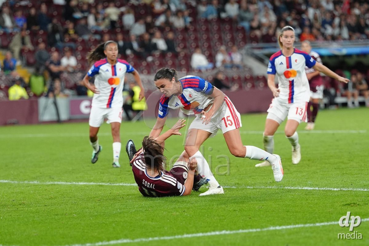 GENEVA, SWITZERLAND - SEPTEMBER 23: Damaris Egurrola of Olympique Lyon with a foul against Magdalena Sobal of Servette FC Chenois Feminin during the UEFA Women's Champions League match between Servette FC Chenois Feminin and OL Lyonnes at Stade de Geneve on September 23, 2026 in Geneva, Switzerland.