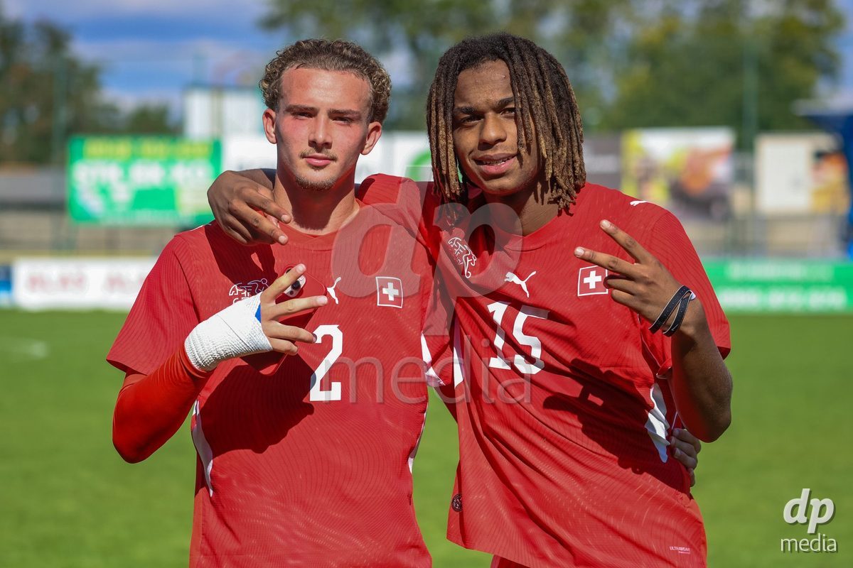 DUNAJSKA LUZNA, SLOVAKIA - SEPTEMBER 25: Marco Correia and Norbu Lhakpa the International Friendly football match between Switzerland U19 and Poland U19 on September 25, 2026 in Dunajska Luzna, Slovakia.