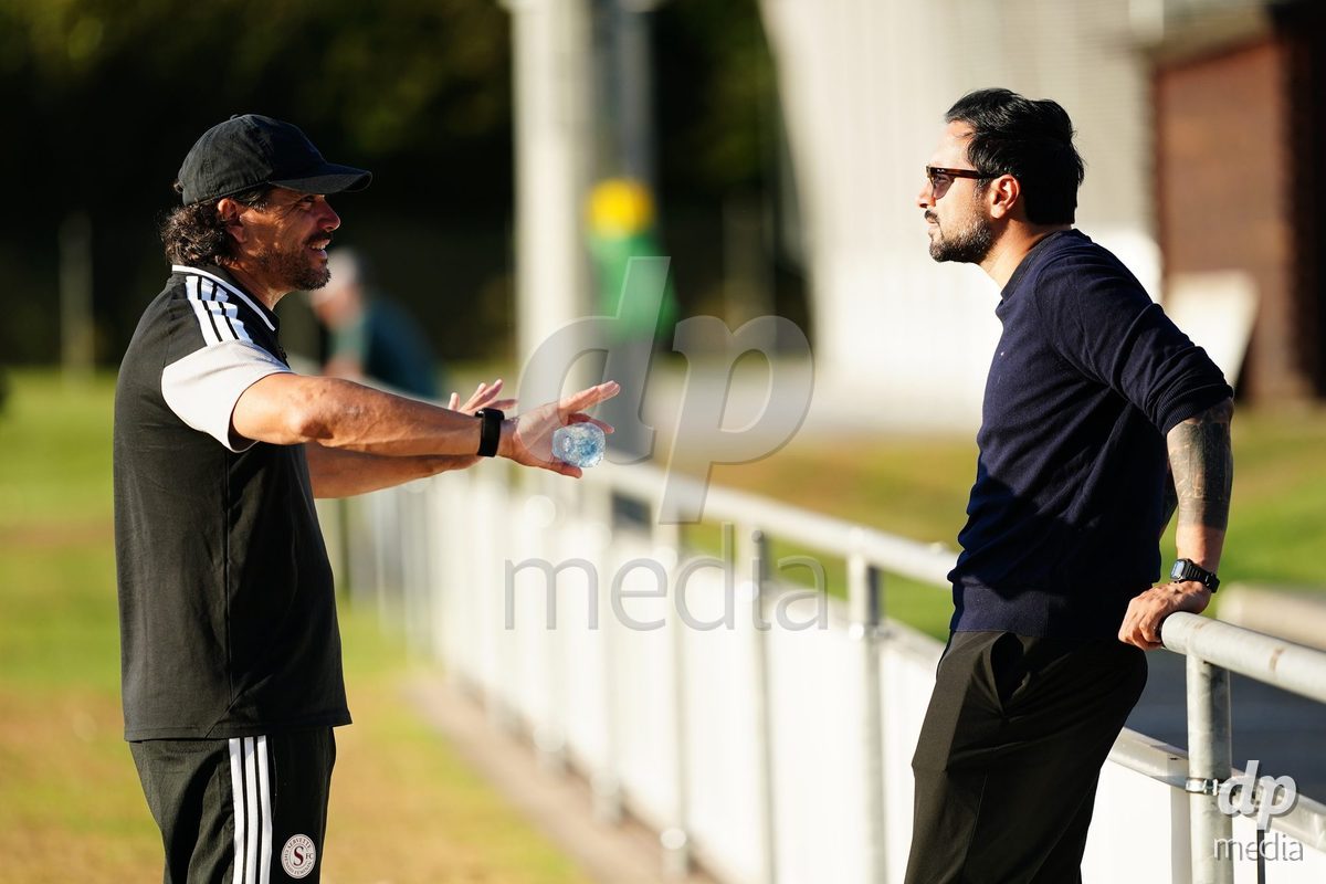 MAGADINO, SWITZERLAND - SEPTEMBER 26:  Cristian Toro head coach of the Servette FC speaks with Yoann Brigante President of the Servette FC during the AXA Women's Cup match between AS Gambarogno and Servette FC Chenois Feminin at Centro Sportivo on September 26, 2026 in Magadino.