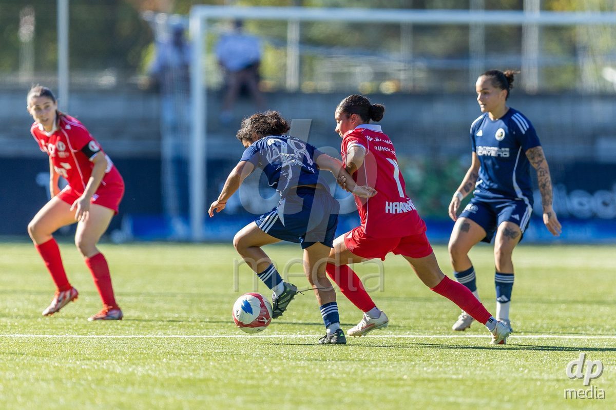 CAROUGE, SWITZERLAND - SEPTEMBER 27: 11 Ramona Kannady of FC Rapperswil-Jona and 28 Lou Djourou Pastor of Etoile Carouge FC challenging with the ball during the AXA Women's Cup match between Etoile Carouge FC and FC Rapperswil-Jona at Stade de la Fontenette on September 27, 2026 in Carouge, Switzerland.