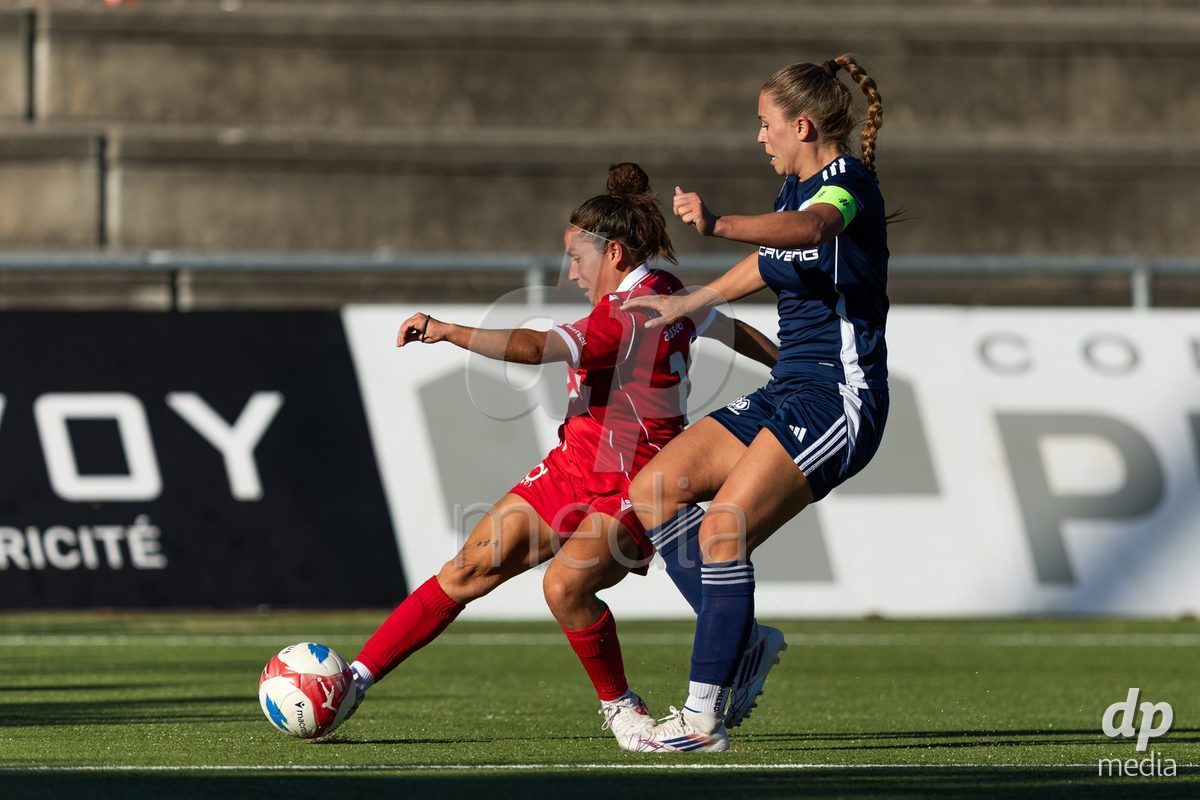 CAROUGE, SWITZERLAND - SEPTEMBER 27: 13 Anna Bove Serra of FC Rapperswil-Jona and 2 Danya Sbai of Etoile Carouge FC in action with the ball during the AXA Women's Cup match between Etoile Carouge FC and FC Rapperswil-Jona at Stade de la Fontenette on September 27, 2026 in Carouge, Switzerland.