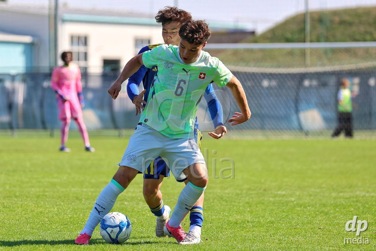 DUNAJSKA LUZNA, SLOVAKIA - SEPTEMBER 28: Ethan Bruchez 6 of Switzerland struggle for the ball during the friendly international football match between Kazakhstan U19 and Switzerland U19 on September 28, 2026 in Dunajska Luzna, Slovakia.
