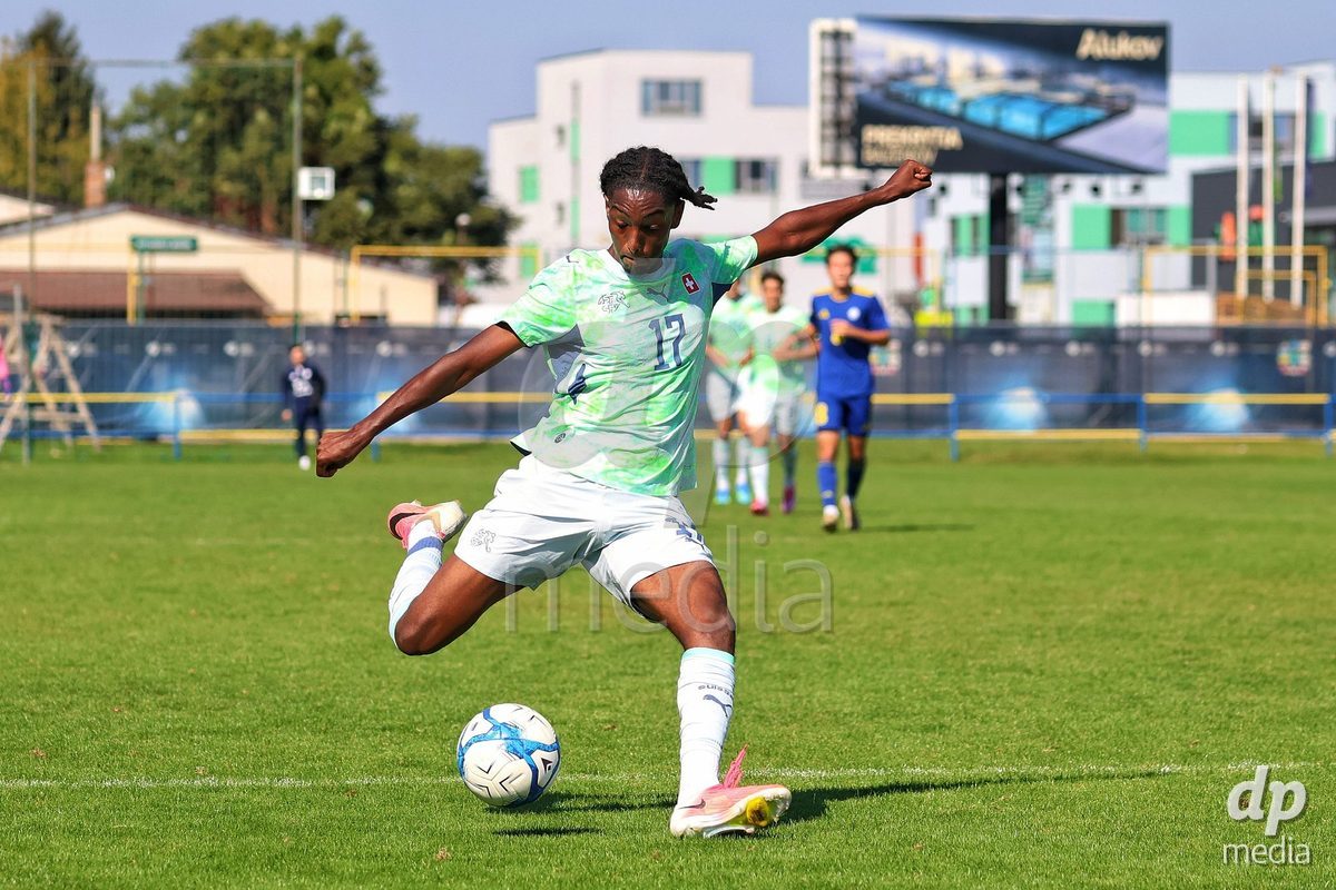 DUNAJSKA LUZNA, SLOVAKIA - SEPTEMBER 28: Josiah Seyfu 17 of Switzerland shoots on goal during the friendly international football match between Kazakhstan U19 and Switzerland U19 on September 28, 2026 in Dunajska Luzna, Slovakia.