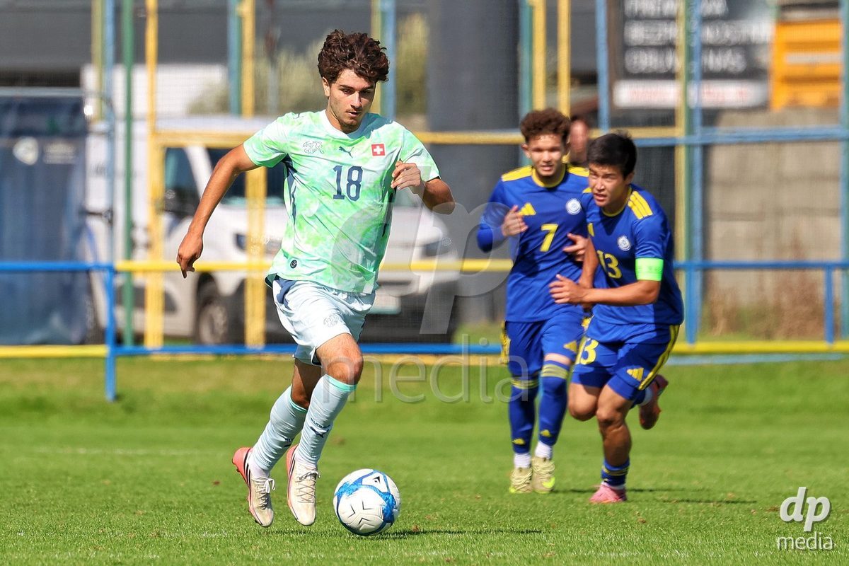 DUNAJSKA LUZNA, SLOVAKIA - SEPTEMBER 28: Denis Sahin 18 of Switzerland struggle for the ball during the friendly international football match between Kazakhstan U19 and Switzerland U19 on September 28, 2026 in Dunajska Luzna, Slovakia.