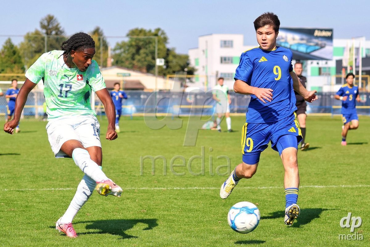 DUNAJSKA LUZNA, SLOVAKIA - SEPTEMBER 28: Josiah Seyfu 17 of Switzerland shoots on goal during the friendly international football match between Kazakhstan U19 and Switzerland U19 on September 28, 2026 in Dunajska Luzna, Slovakia.