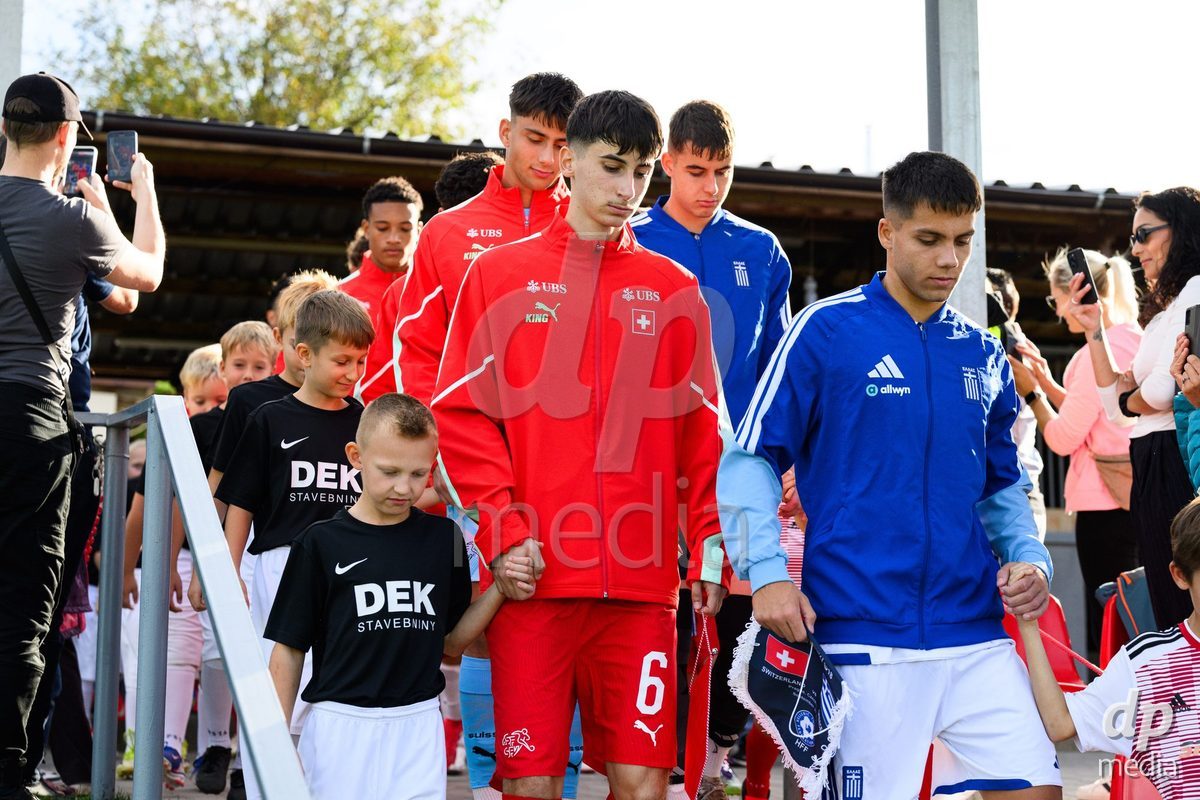 KOSMONSY, CZECH REPUBLIC - SEPTEMBER 30: Team captains Aldin Smajic of Switzerland (left) and Konstantinos Souvlatzis of Greece taking the field for the International Friendly match between Switzerland U18 and Greece U18 on September 30, 2026 in Kosmonsy, Czech Republic.