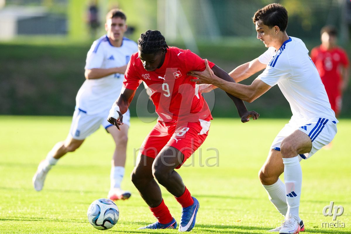 KOSMONSY, CZECH REPUBLIC - SEPTEMBER 30: Shedrach Ogbodu of Switzerland a Andreas Poulopoulos of Greece during the International Friendly match between Switzerland U18 and Greece U18 on September 30, 2026 in Kosmonsy, Czech Republic.