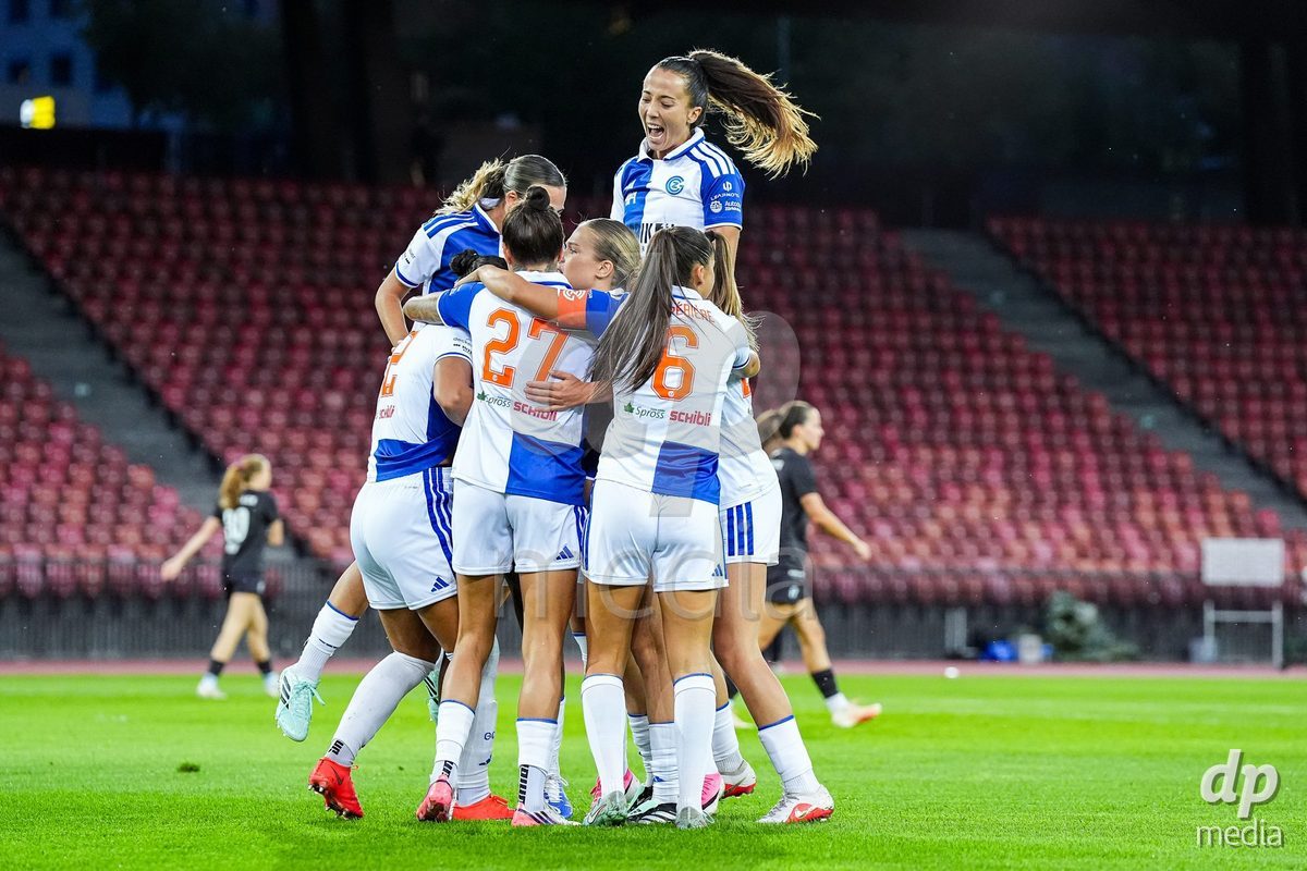 ZURICH, SWITZERLAND - OCTOBER 2: Kayla Mckenna of Grasshopper Club Zurich (L) celebrates with teammates after scoring her teams first goal during the AXA Women's Super League match between GC Frauenfussball and FC Zurich at Letzigrund on October 2, 2026 in Zurich, Switzerland.
