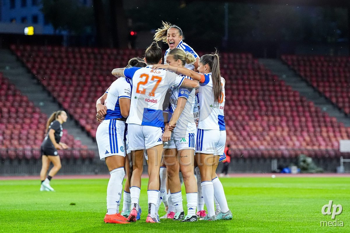 ZURICH, SWITZERLAND - OCTOBER 2: Kayla Mckenna of Grasshopper Club Zurich (L) celebrates with teammates after scoring her teams first goal during the AXA Women's Super League match between GC Frauenfussball and FC Zurich at Letzigrund on October 2, 2026 in Zurich, Switzerland.