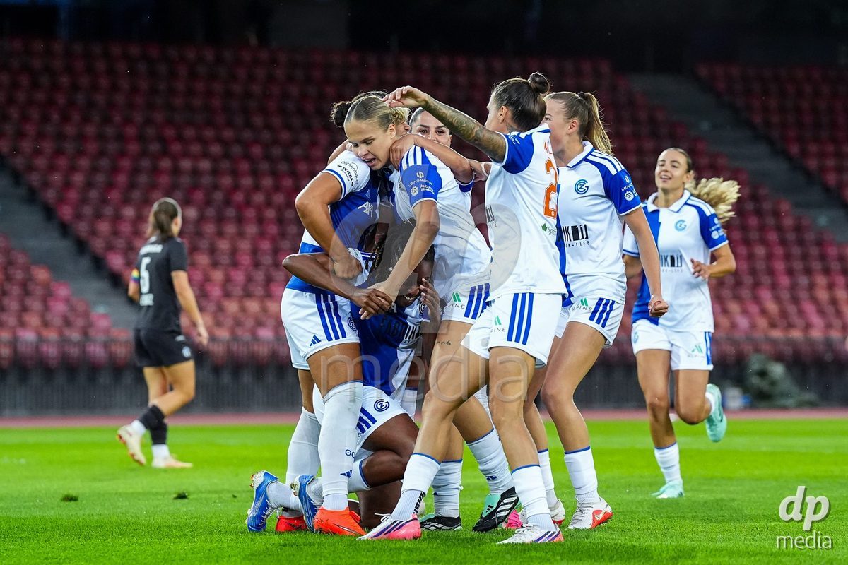 ZURICH, SWITZERLAND - OCTOBER 2: Kayla Mckenna of Grasshopper Club Zurich (L) celebrates with teammates after scoring her teams first goal during the AXA Women's Super League match between GC Frauenfussball and FC Zurich at Letzigrund on October 2, 2026 in Zurich, Switzerland.