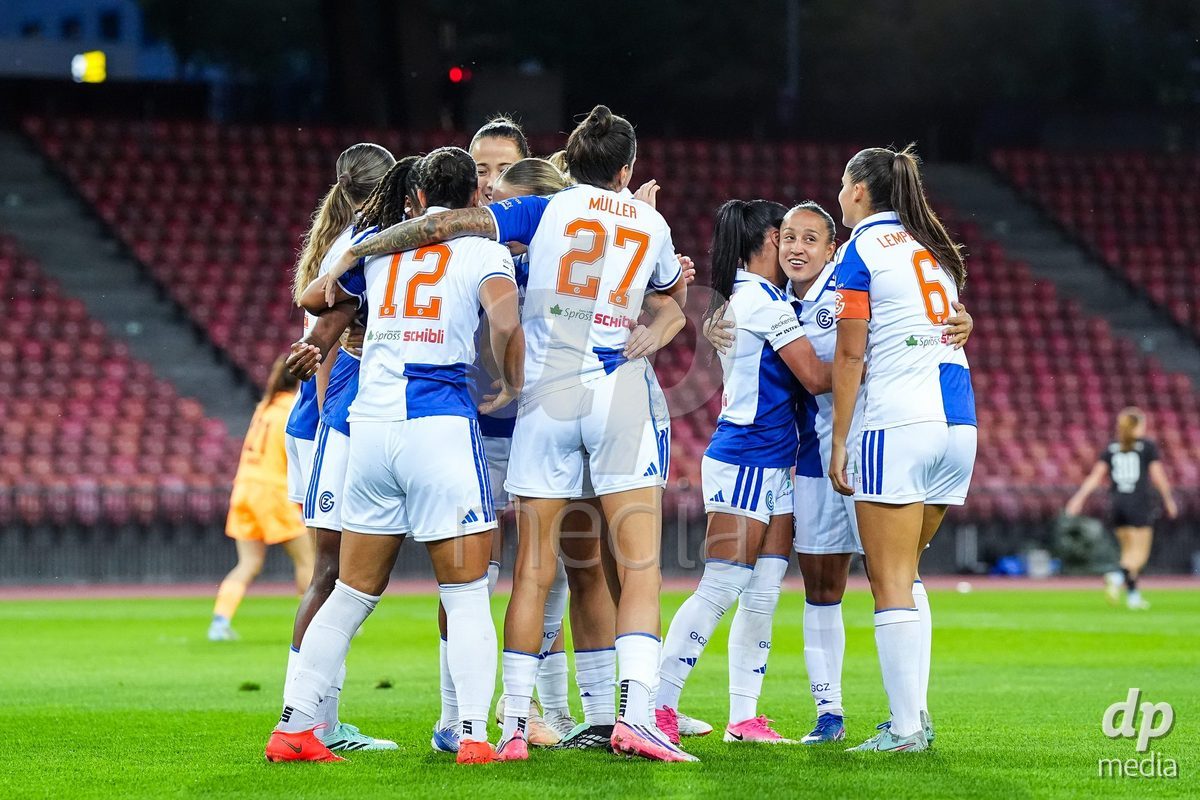 ZURICH, SWITZERLAND - OCTOBER 2: Kayla Mckenna of Grasshopper Club Zurich (L) celebrates with teammates after scoring her teams first goal during the AXA Women's Super League match between GC Frauenfussball and FC Zurich at Letzigrund on October 2, 2026 in Zurich, Switzerland.