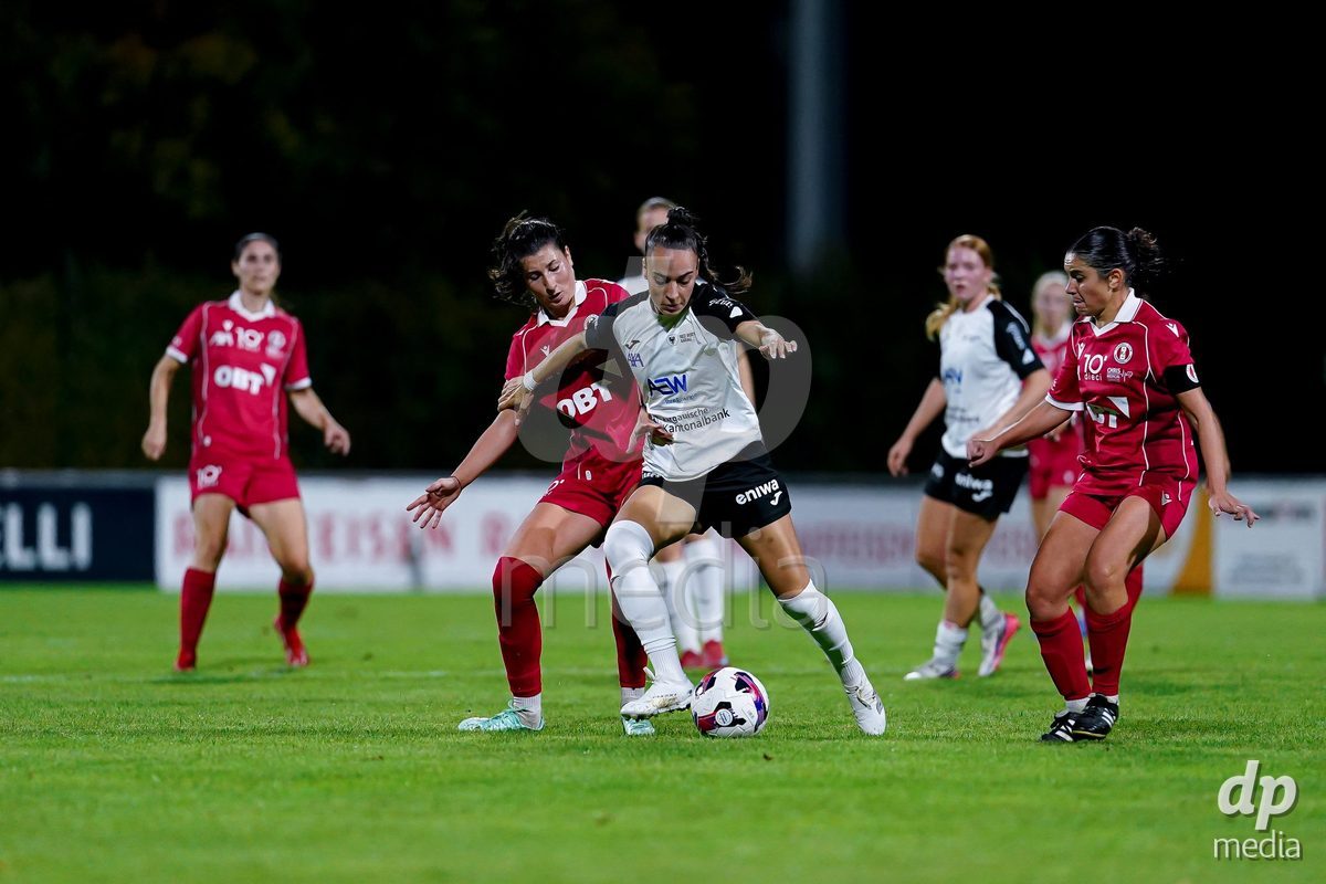 RAPPERSWIL, SWITZERLAND - OCTOBER 3: Rita Filipa Do Sul Almeida of FC Aarau Frauen (R) and Zdravka Petrova Parapunova of FC Rapperswil-Jona (L) battle for the ball during the AXA Women's Super League match between FC Rapperswil-Jona and FC Aarau Frauen at Grunfeld on October 3, 2026 in Rapperswil, Switzerland.