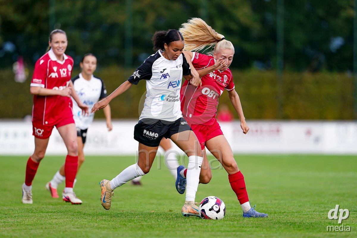 RAPPERSWIL, SWITZERLAND - OCTOBER 3: Sophie Alice Profé of FC Rapperswil-Jona (R) and Joy Steck of FC Aarau Frauen (L) battle for the ball during the AXA Women's Super League match between FC Rapperswil-Jona and FC Aarau Frauen at Grunfeld on October 3, 2026 in Rapperswil, Switzerland.