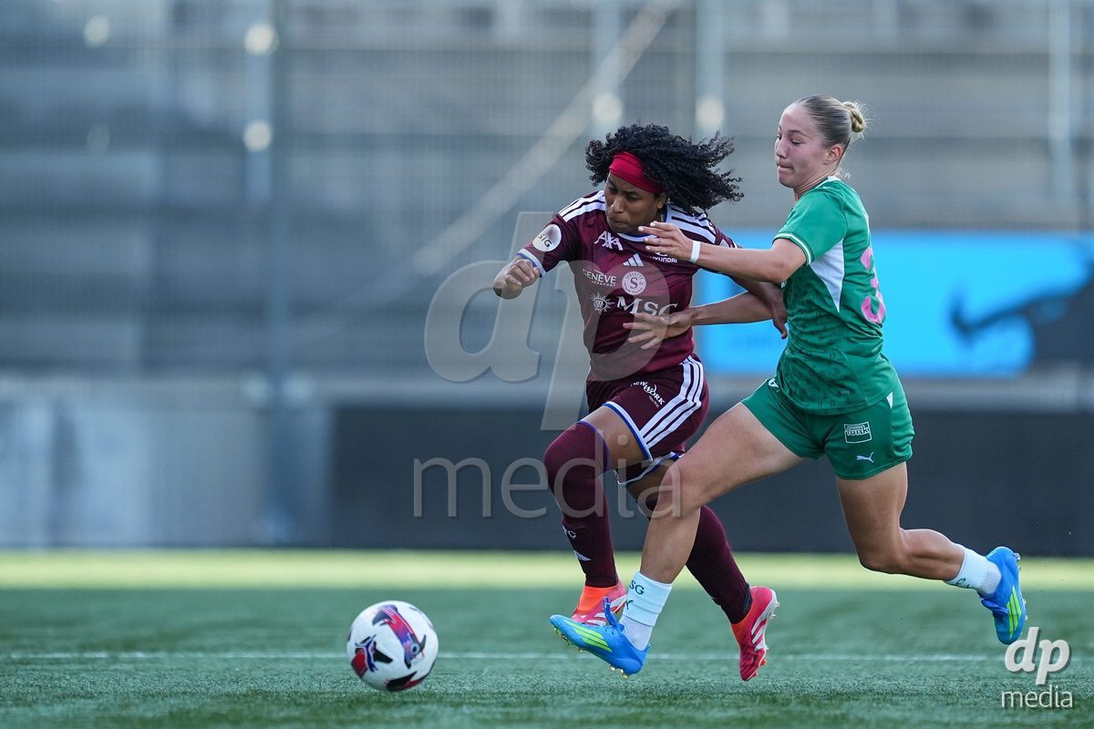 WIL, SWITZERLAND - OCTOBER 4: Mickaella Francoise Halooa Cardia of Servette FC Chenois Feminin (L) and Johanna Thuer of FC St. Gallen (R) battle for the ball (duel) during the AXA Women's Super League match between FC St. Gallen 1879 and Servette FC Chenois Feminin at Lidl Sportpark on October 4, 2026 in Wil, Switzerland.