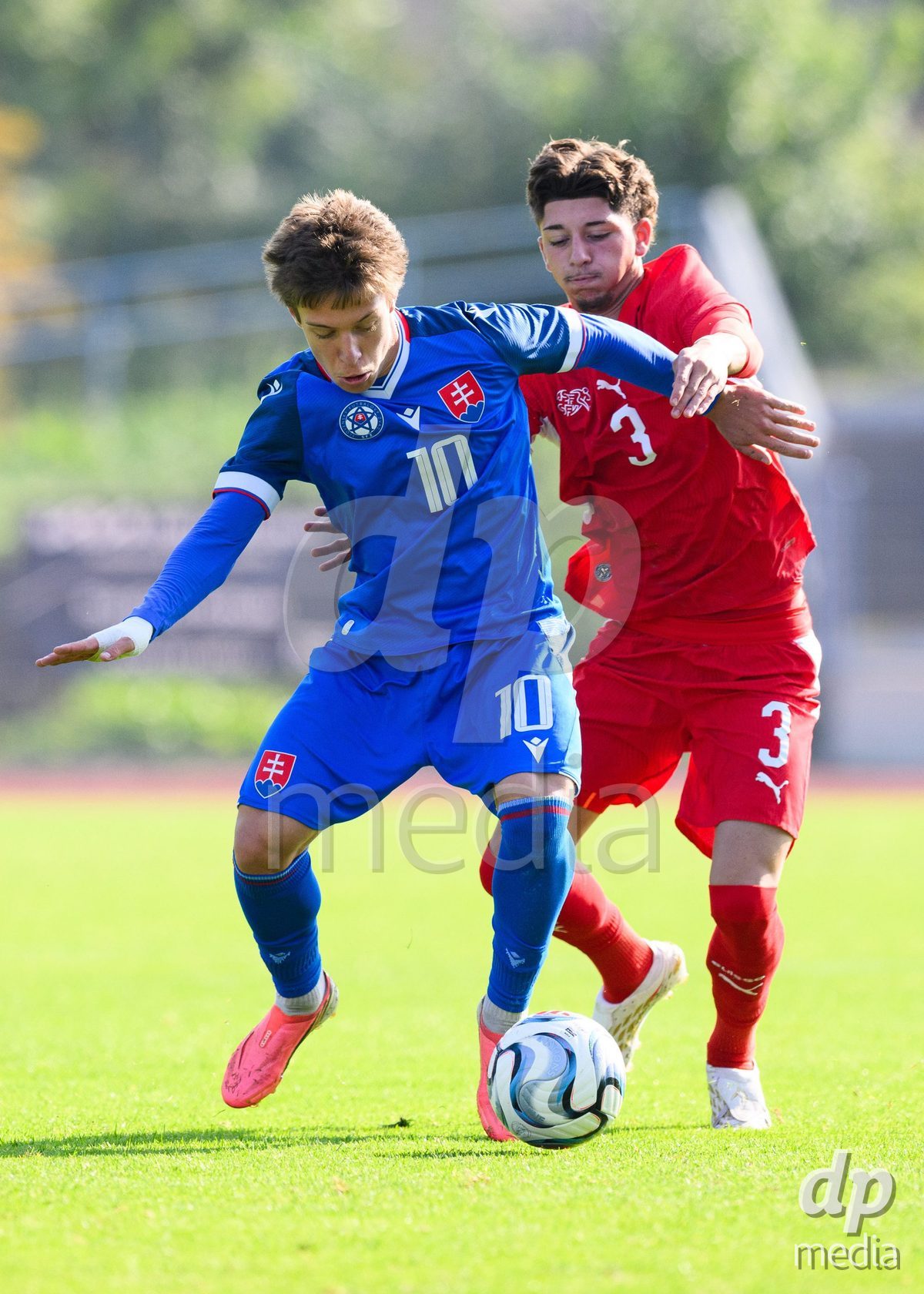 USTI NAD LABEM, CZECH REPUBLIC - OCTOBER 3: Matus Tomasko of Slovakia (left) and Gabriel Roskovic of Switzerland during the International Friendly match between Slovakia and Switzerland on October 3, 2026 in Ustí nad Labem, Czech Republic.