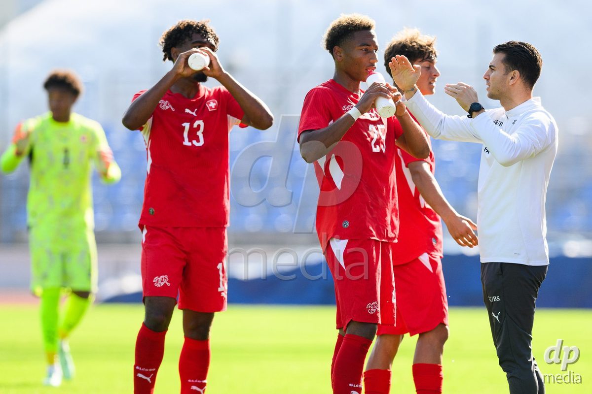 USTI NAD LABEM, CZECH REPUBLIC - OCTOBER 3: Players of Switzerland L-R: Ryan Taouriti, Mathis Dind and assistant coach Francesco Azzarito during warm up before the International Friendly match between Slovakia and Switzerland on October 3, 2026 in Ustí nad Labem, Czech Republic.