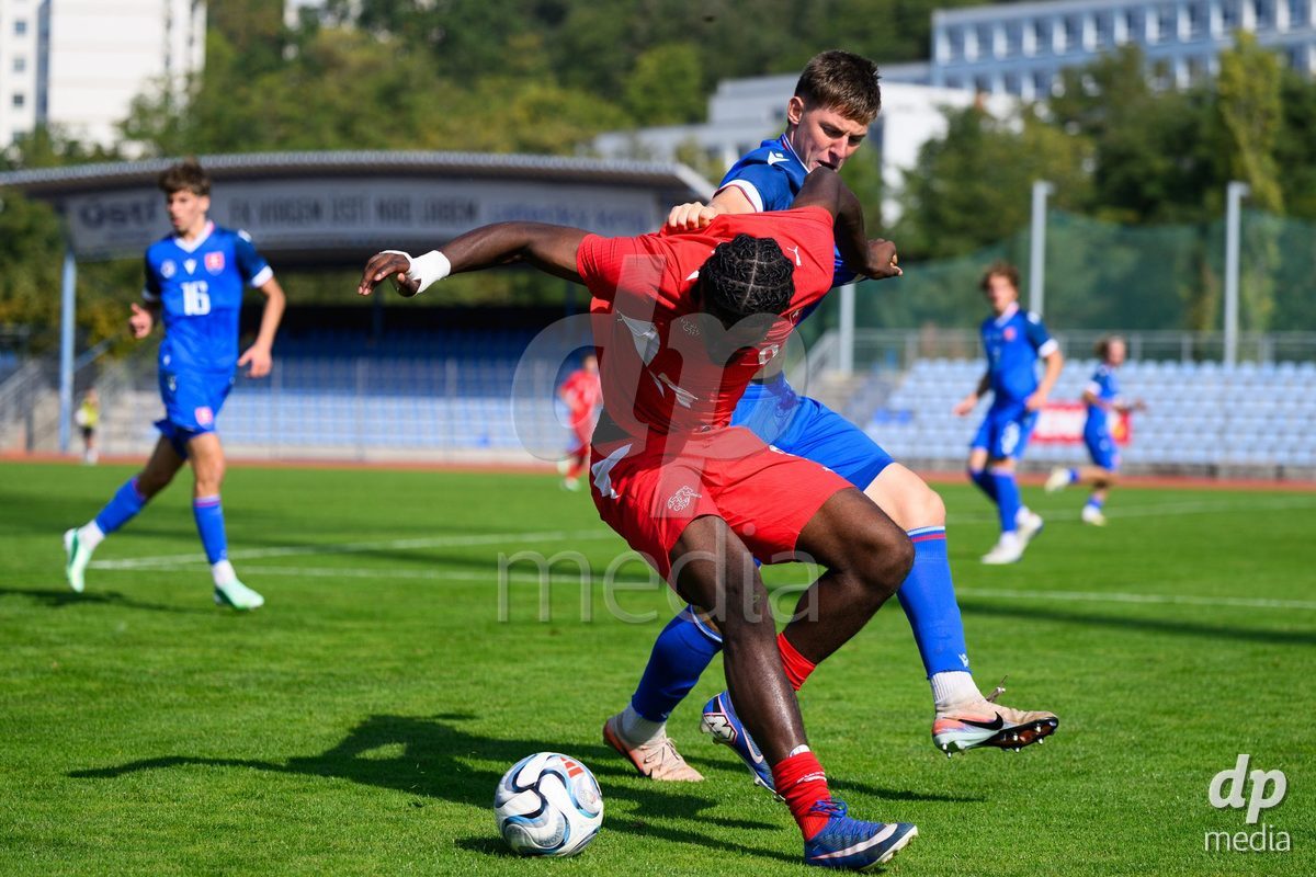 USTI NAD LABEM, CZECH REPUBLIC - OCTOBER 3: Shedrach Ogbodu of Switzerland (left) and Simon Hubona of Slovakia during the International Friendly match between Slovakia and Switzerland on October 3, 2026 in Ustí nad Labem, Czech Republic.