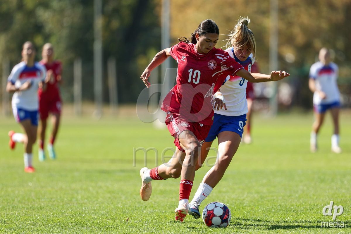 KAKANJ, BOSNIA AND HERZEGOVINA - OCTOBER 7: Mila Bischoff of Denmark and Kyri Teer-Hutchins of England during the UEFA Womens European Under-19 Qualifier match between England and Denmark at Mladost Stadium on October 7, 2026 in Kakanj, Bosnia and Herzegovina.