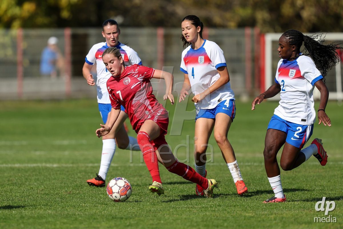 KAKANJ, BOSNIA AND HERZEGOVINA - OCTOBER 7: Nellie Mulvad Gejel of Denmark and Romia Gagliano and Damilola Atinaro of England during the UEFA Womens European Under-19 Qualifier match between England and Denmark at Mladost Stadium on October 7, 2026 in Kakanj, Bosnia and Herzegovina.