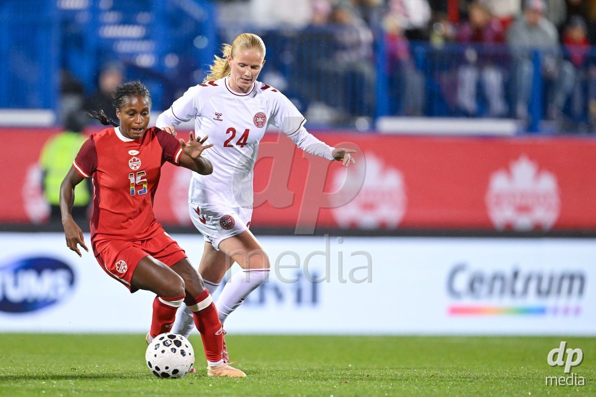 MONTREAL, CANADA - OCTOBER 9: Nichelle Prince of Canada (L) and Carli Scheuer of Denmark (R) battle for the ball (duel)  during the International Women's Friendly football match between Canada and Denmark at Stade Saputo on October 9, 2026 in Montreal, Canada.