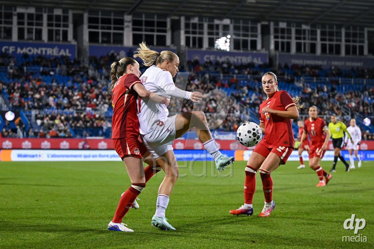 MONTREAL, CANADA - OCTOBER 9: Anna Walter of Denmark battles for the ball (duel)  during the International Women's Friendly football match between Canada and Denmark at Stade Saputo on October 9, 2026 in Montreal, Canada.