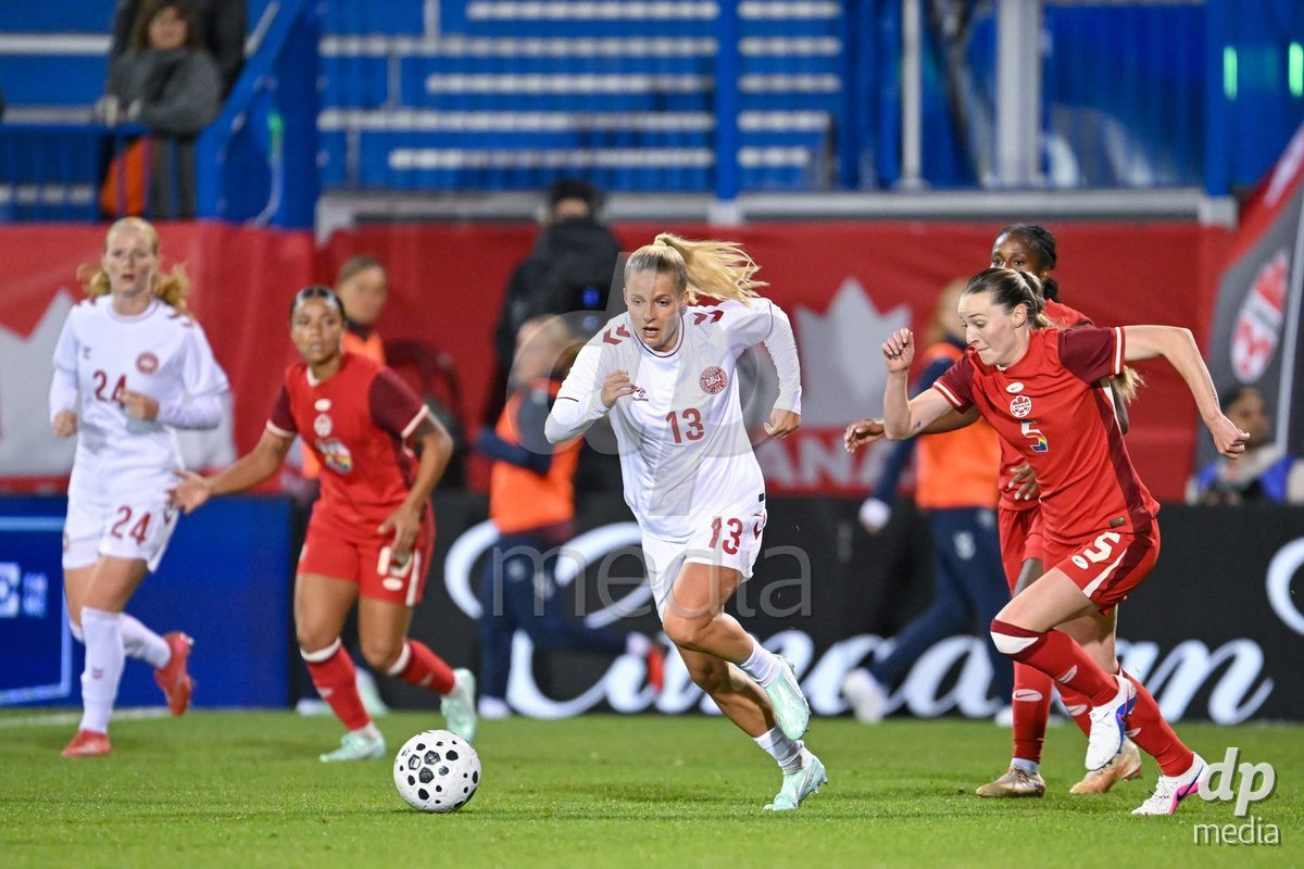 MONTREAL, CANADA - OCTOBER 9: Olivia Holdt of Denmark (L) and Gabrielle Carle of Canada (R) battle for the ball (duel) during the International Women's Friendly football match between Canada and Denmark at Stade Saputo on October 9, 2026 in Montreal, Canada.