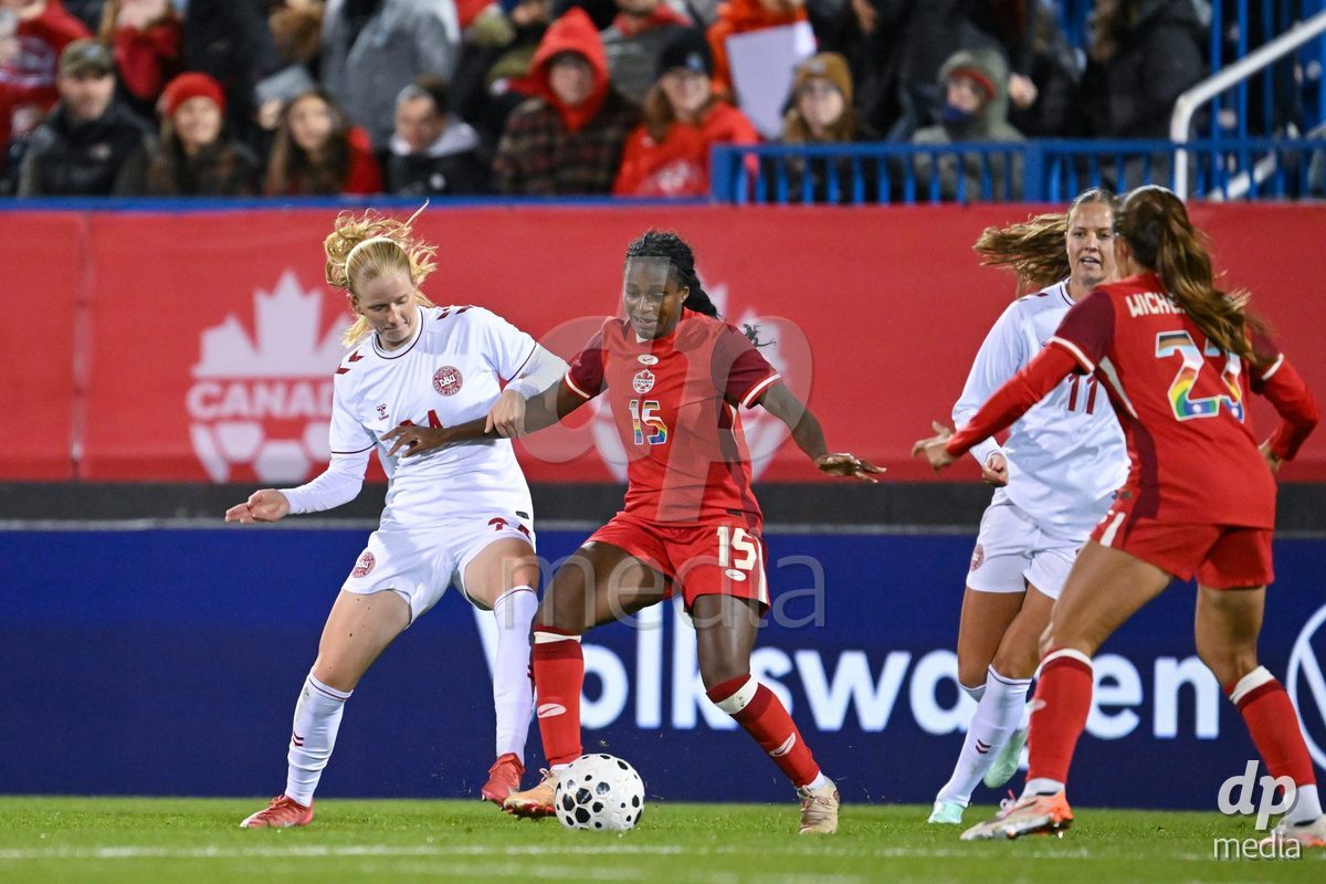 MONTREAL, CANADA - OCTOBER 9: Sofie Bredgaard of Denmark (L) and Nichelle Prince of Canada (R) battle for the ball (duel) during the International Women's Friendly football match between Canada and Denmark at Stade Saputo on October 9, 2026 in Montreal, Canada.