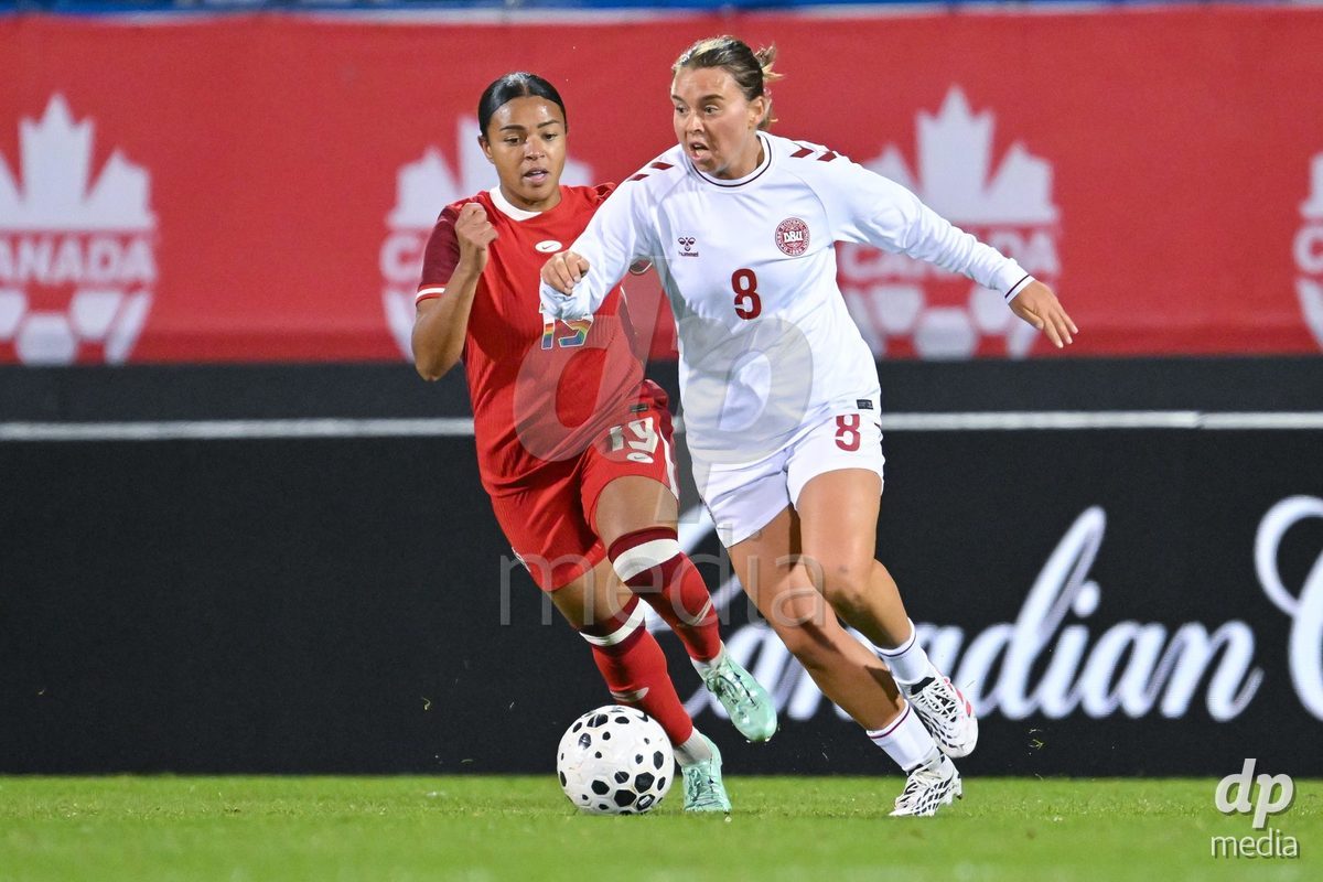 MONTREAL, CANADA - OCTOBER 9: Marie Yasmine Alidou of Canada (L) and Emma Snerle of Denmark (R) battle for the ball (duel) during the International Women's Friendly football match between Canada and Denmark at Stade Saputo on October 9, 2026 in Montreal, Canada.