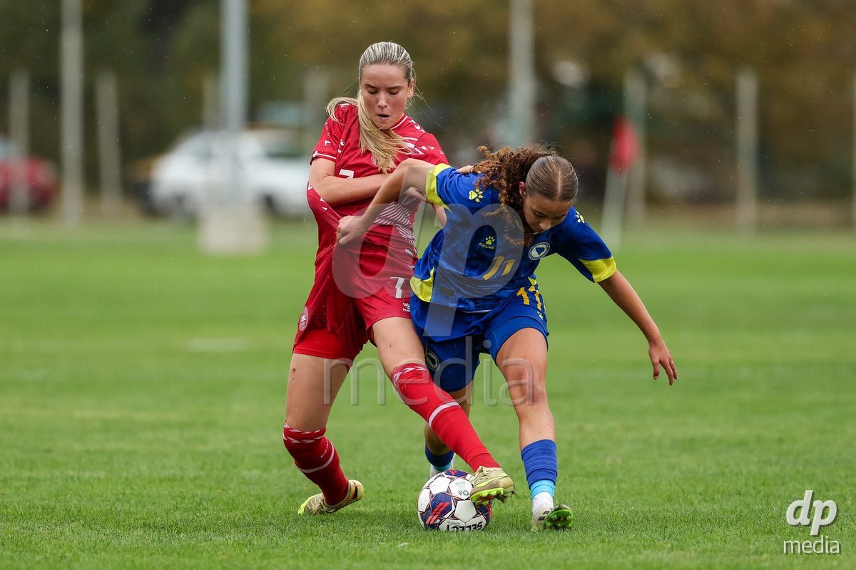 KAKANJ, BOSNIA AND HERZEGOVINA - OCTOBER 10: Nellie Mulvad Gejel of Denmark and Sara Mujdzic of Bosnia and Herzegovina during the UEFA Womens European Under-19 Qualifier match between Denmark and Bosnia and Herzegovina at Mladost Stadium on October 10, 2026 in Kakanj, Bosnia and Herzegovina. Photo: Armin Durgut/Pixsell/DP Media