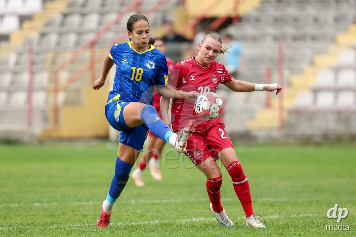 KAKANJ, BOSNIA AND HERZEGOVINA - OCTOBER 10: Hana Mesan of Bosnia and Herzegovina and Nikoline Nielsen of Denmark competes for the ball during the UEFA Womens European Under-19 Qualifier match between Denmark and Bosnia and Herzegovina at Mladost Stadium on October 10, 2026 in Kakanj, Bosnia and Herzegovina. Photo: Armin Durgut/Pixsell/DP Media