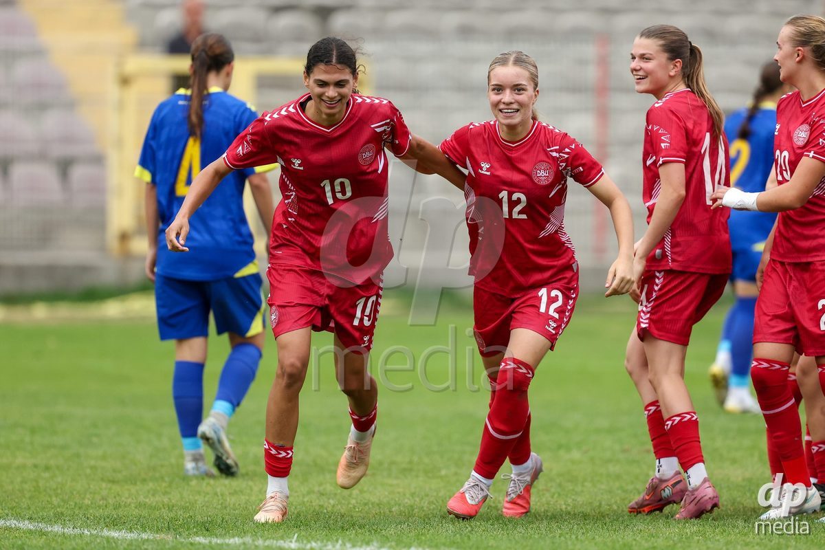 KAKANJ, BOSNIA AND HERZEGOVINA - OCTOBER 10: Mila Bischoff of Denmark, Evelina Thygesen of Denmark and Nicoline Jorgensen Klintskov of Denmark celebrate after scoring a goal during the UEFA Womens European Under-19 Qualifier match between Denmark and Bosnia and Herzegovina at Mladost Stadium on October 10, 2026 in Kakanj, Bosnia and Herzegovina. Photo: Armin Durgut/Pixsell/DP Media