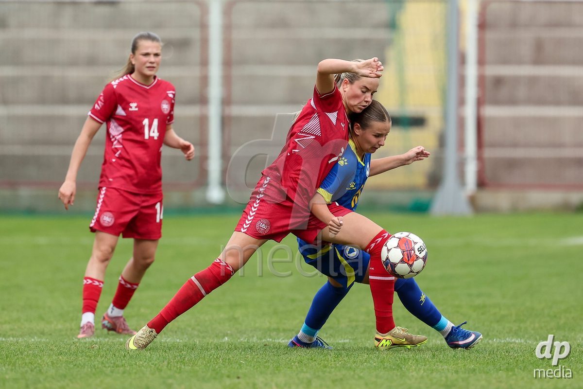 KAKANJ, BOSNIA AND HERZEGOVINA - OCTOBER 10: Nellie Mulvad Gejel of Denmark and Uma Hadzihajdarevic of Bosnia and Herzegovina during the UEFA Womens European Under-19 Qualifier match between Denmark and Bosnia and Herzegovina at Mladost Stadium on October 10, 2026 in Kakanj, Bosnia and Herzegovina. Photo: Armin Durgut/Pixsell/DP Media