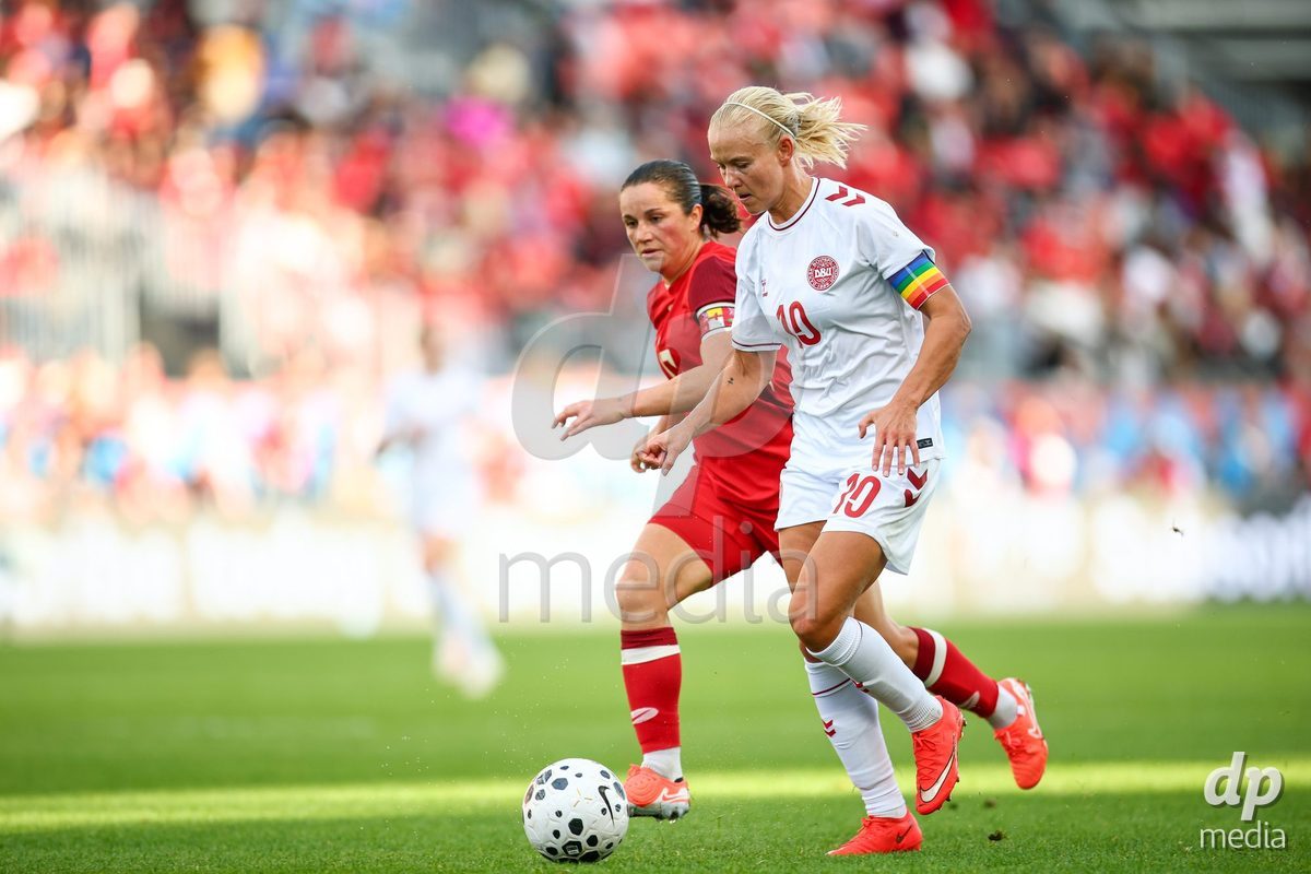 TORONTO, CANADA - OCTOBER 12: Pernille Harder of Denmark (R) and Jessie Fleming of Canada (L) battle for the ball (duel) during the International Friendly match between Canada and Denmark at BMO Field on October 12, 2026 in Toronto, Canada.