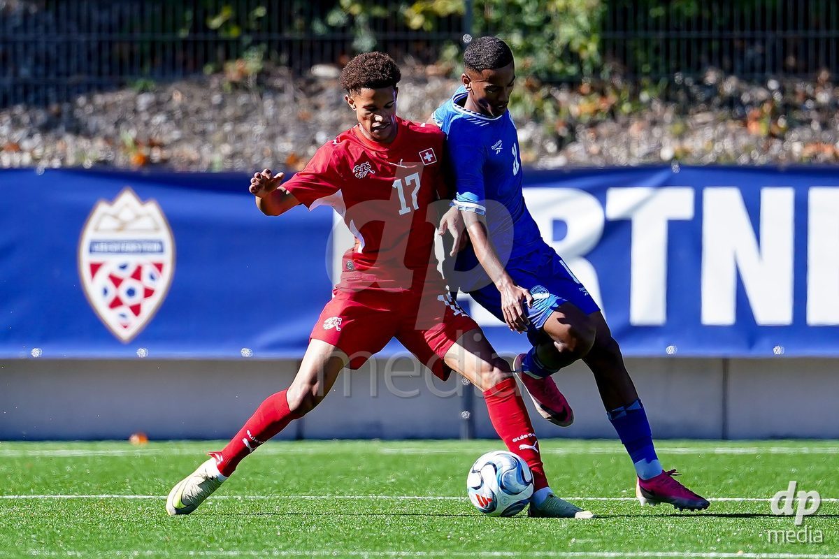SCHAAN, LIECHTENSTEIN - OCTOBER 12: Kyle Kurt of Switzerland and Amit Yehais of Israel battle for the ball during the UEFA European Under-17 Qualifier match between Israel and Switzerland at LFV Campus Rheinwiese on October 12, 2026 in Schaan, Liechtenstein.