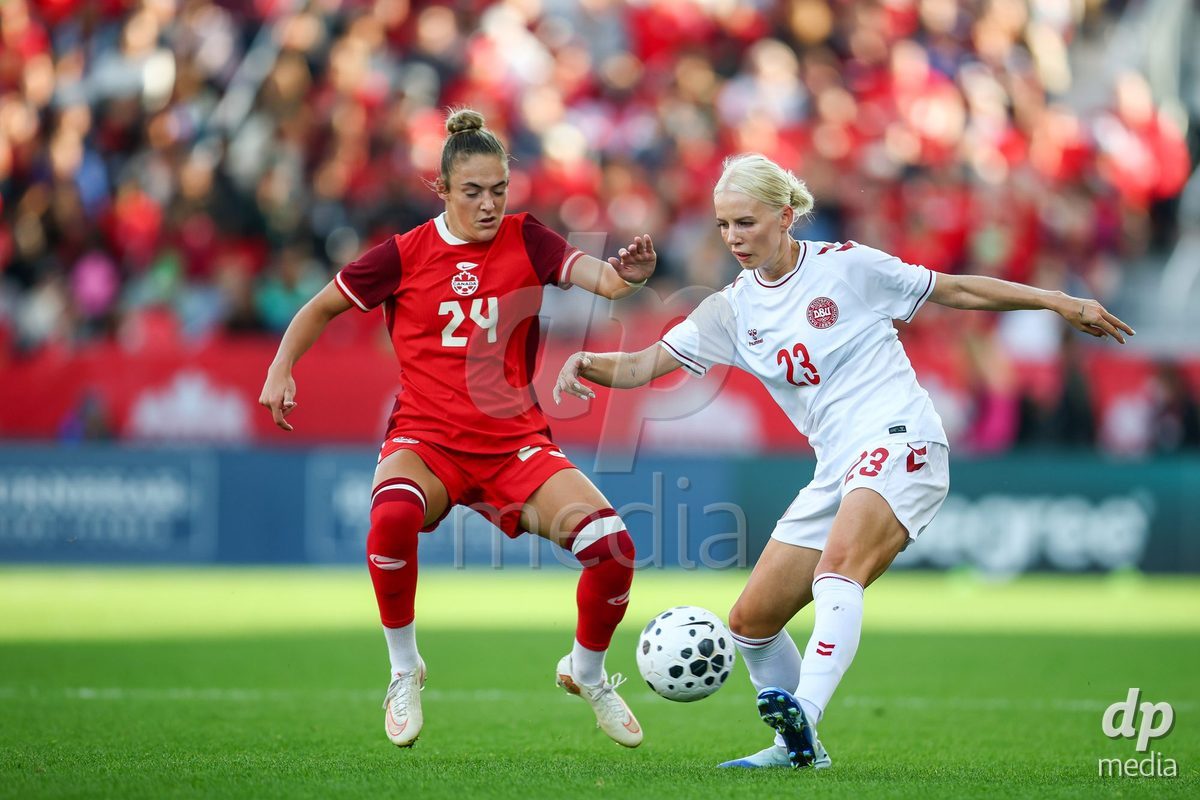 TORONTO, CANADA - OCTOBER 12: Sofie Svava of Denmark (R) and Kaylee Hunter of Canada (L) battle for the ball during the International Friendly match between Canada and Denmark at BMO Field on October 12, 2026 in Toronto, Canada.