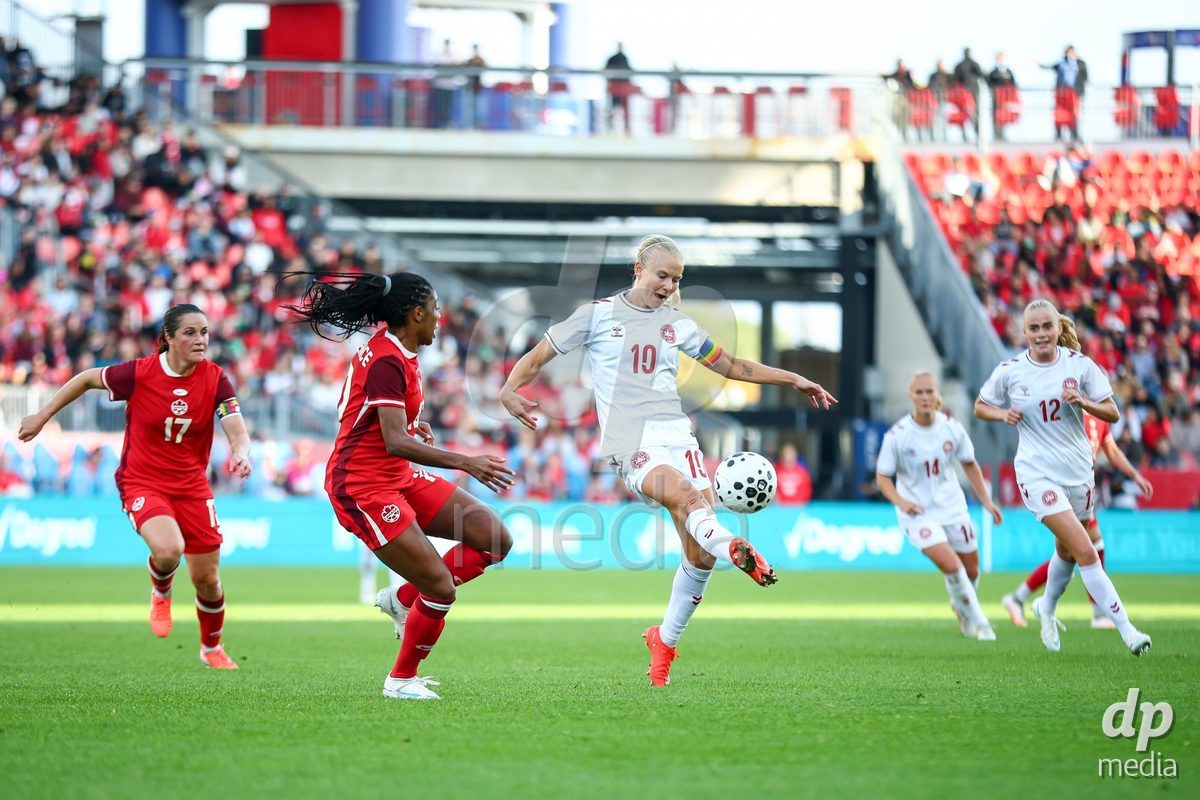 TORONTO, CANADA - OCTOBER 12: Pernille Harder of Denmark (C) battles for the ball during the International Friendly match between Canada and Denmark at BMO Field on October 12, 2026 in Toronto, Canada.
