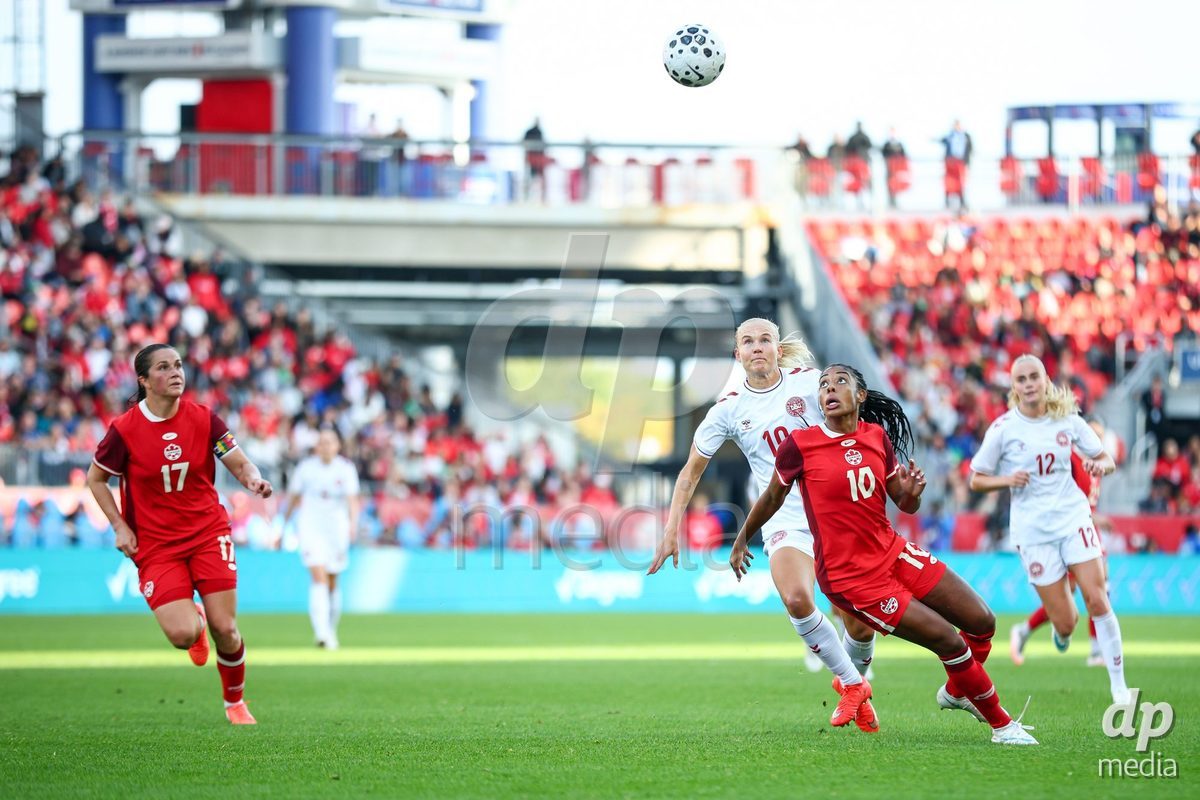 TORONTO, CANADA - OCTOBER 12: Pernille Harder of Denmark (L) and Ashley Lawrence of Canada (R) battle for the ball (duel) during the International Friendly match between Canada and Denmark at BMO Field on October 12, 2026 in Toronto, Canada.