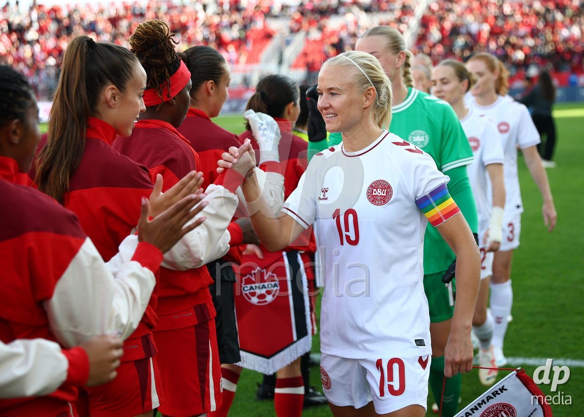 TORONTO, CANADA - OCTOBER 12: Pernille Harder of Denmark shakes hands with Canada players before the International Friendly match against Canada at BMO Field on October 12, 2026 in Toronto, Canada.
