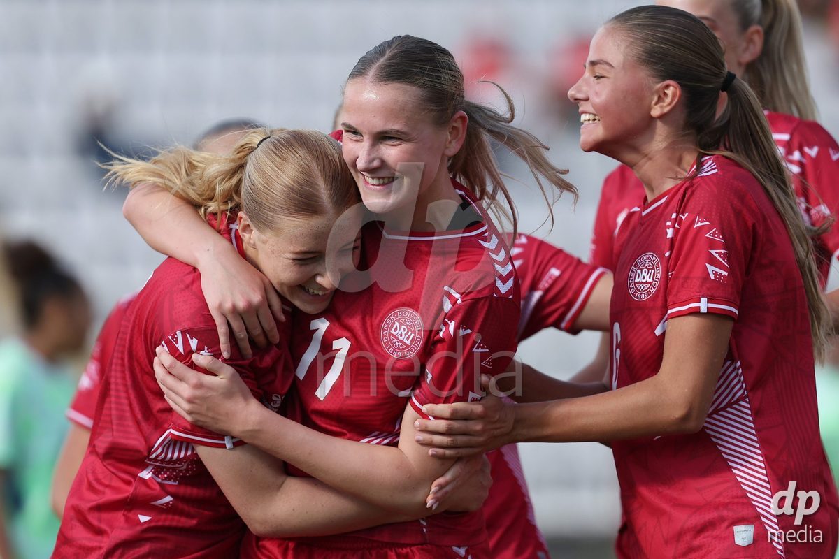 KAKANJ, BOSNIA AND HERZEGOVINA - OCTOBER 13: Asta Kynde of Denmark, Andrea Thierry of Denmark and Josephine Behrmann Lamp of Denmark celebrate after Asta Kynde of Denmark score a goal for 6:2 during the UEFA Womens European Under-19 Qualifier match between Denmark and Switzerland at Mladost Stadium on October 13, 2026 in Kakanj, Bosnia and Herzegovina. Photo: Armin Durgut/Pixsell/DP Media