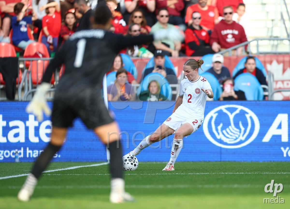 TORONTO, CANADA - OCTOBER 12: Sara Thrige of Denmark crosses the ball during the International Friendly match against Canada at BMO Field on October 12, 2026 in Toronto, Canada.