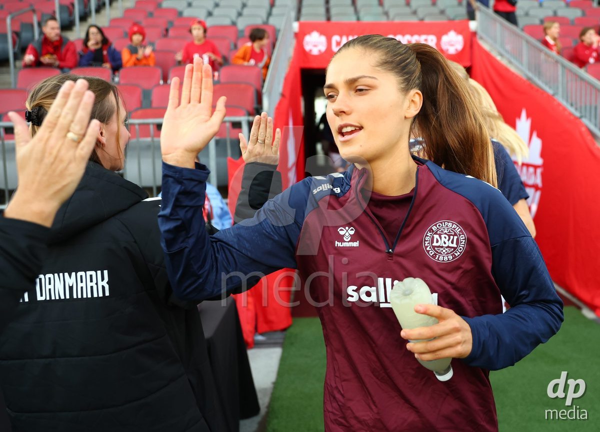 TORONTO, CANADA - OCTOBER 12: Mille Gejl of Denmark runs out for warmups before the International Friendly match against Canada at BMO Field on October 12, 2026 in Toronto, Canada.