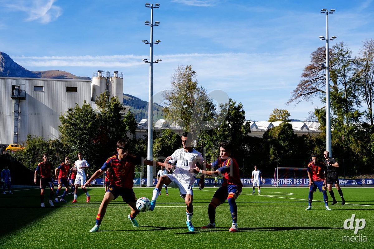 SCHAAN, LIECHTENSTEIN - OCTOBER 15: Noam Azrane of Israel, Joel Palle of Spain and Joaquin Sanchez of Spain battle for the ball during the UEFA European Under-17 Qualifier match between Spain and Israel at LFV Campus Rheinwiese on October 15, 2026 in Schaan, Liechtenstein.