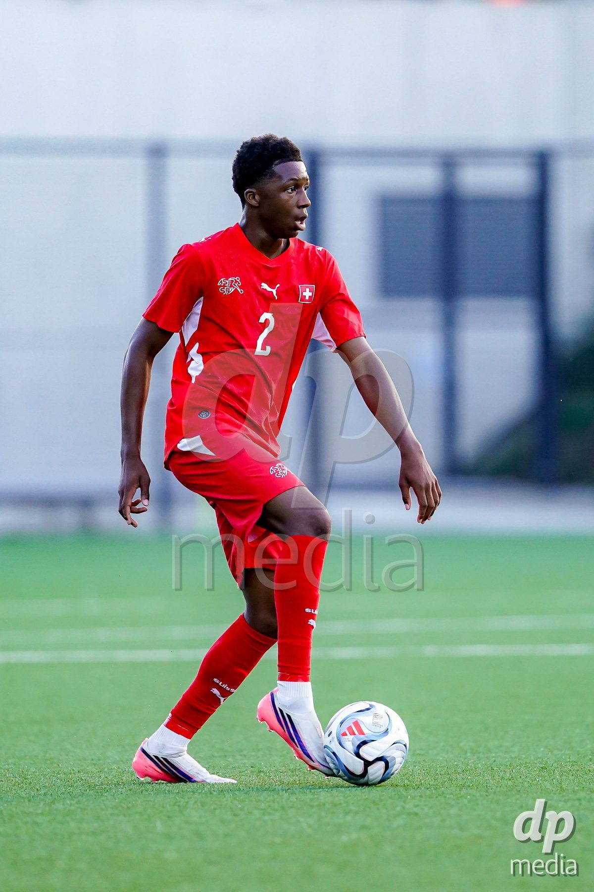 SCHAAN, LIECHTENSTEIN - OCTOBER 15: Darren Okoh of Switzerland controls the ball during the UEFA European Under-17 Qualifier match between Switzerland and Liechtenstein at LFV Campus Rheinwiese on October 15, 2026 in Schaan, Liechtenstein.