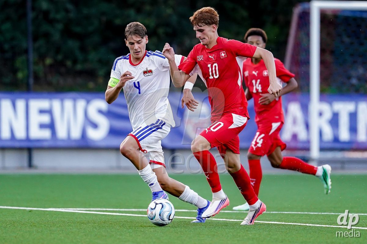 SCHAAN, LIECHTENSTEIN - OCTOBER 15: Eron Kele of Switzerland and Alexander Matheis of Liechtenstein battle for the ball during the UEFA European Under-17 Qualifier match between Switzerland and Liechtenstein at LFV Campus Rheinwiese on October 15, 2026 in Schaan, Liechtenstein.