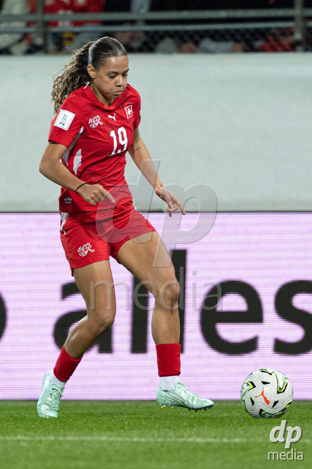 SION, SWITZERLAND, OCTOBER 13 : Iman Beney of Switzerland drives the ball during the FIFA Women's World Cup 2027 Women's European Qualifiers Play-offs game between Switzerland and Israel at Stade de Tourbillon on October 13, 2026 in Sion, Switzerland.
